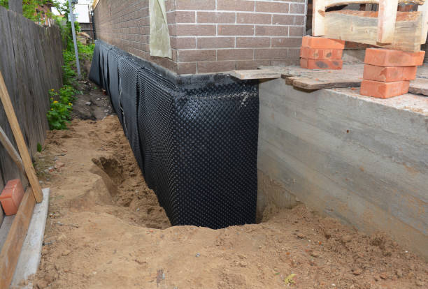 SJ Waterproofing Pros technician performing targeted Emergency Waterproofing assessment in Beallsville, MD